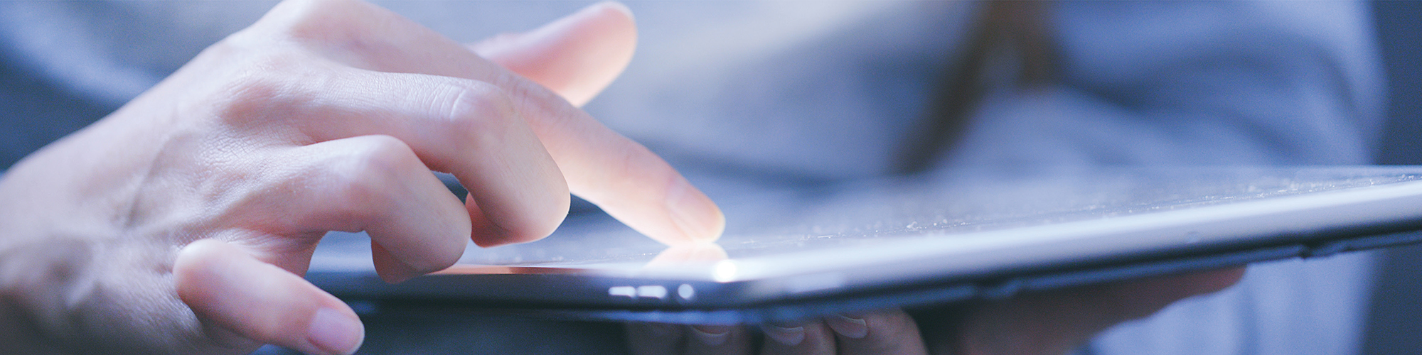 Person scrolling through tablet